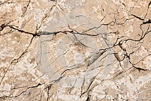 Stone cracked wall texture. Stone background. Cracks in the stone.