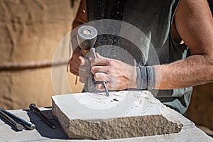 Stone craftsman working in his stonekeeping workshop