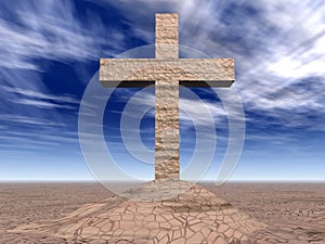 Stone cross on the cracked ground
