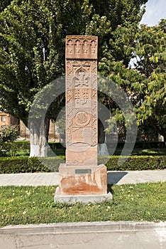 Stone cross in Echmiadzin Vagharshapat made of red stone tufa.