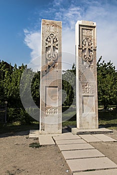 Stone cross in Echmiadzin Vagharshapat made of red stone tufa.