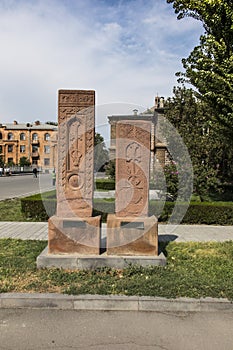 Stone cross in Echmiadzin Vagharshapat made of red stone tufa.