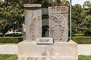 Stone cross in Echmiadzin Vagharshapat made of red stone tufa.