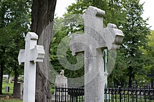 Stone cross gravestones on cemetery - graveyard