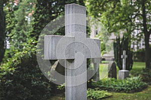 Stone cross gravestones on cemetery - graveyard