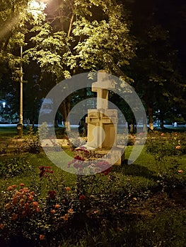 Stone cross in Politehnica park in Bucuresti at night