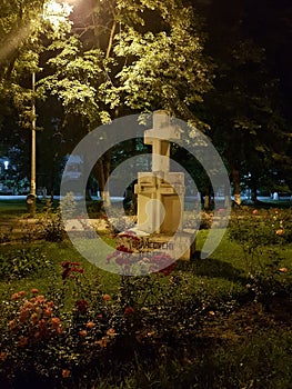 Stone cross in Politehnica park in Bucuresti at night photo