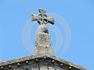 stone cross on the roof of the building. Porto Portugal.