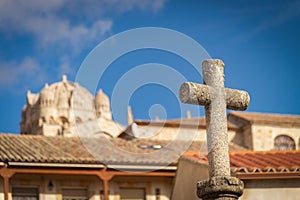 Stone Cross at San Claudio de Olivares Square with Zamora Cathedral in Background photo