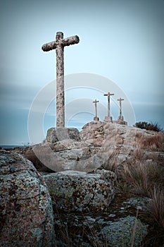 Stone cross with sky background dusk cloudy photo