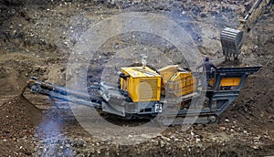 Stone crusher and crane in working