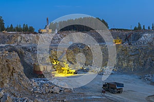 Stone crusher in a quarry. mining industry, night view