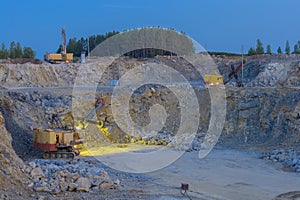 Stone crusher in a quarry. mining industry, night view