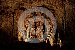 The stone curtain into the huge cavern of Orgnac Aven photo