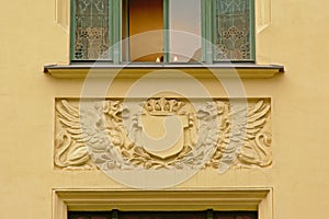 Stone decoration of shield an two griffons, found on a house in Riga, Latvia