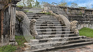 Stone dragon statues on the steps to the terrace of the garden of the Forbidden city, Imperial City, Citadel, Hue, Vietnam