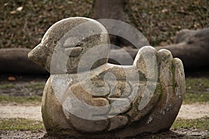 Stone duck sculpture in a park