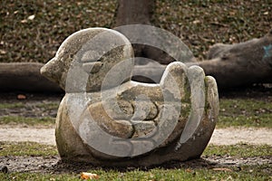 Stone duck sculpture in a park