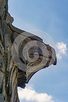 Stone Eagle head against blue sky