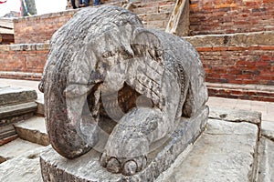 Stone elephant sculpture in fornt of a temple at Durbar Square in Patan, Lalitpur, Nepal