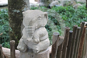 Stone elephant statue on nature background, front view, Clipping