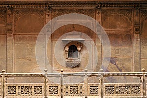 Stone elevation with the small window in Haveli Rajasthan photo