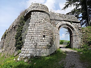 Stone entrance along the wall surrounding a medieval village