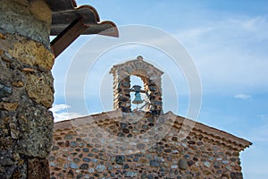Stone facade of the Chapel of the Penitents with its small bell tower, in Upaix, Hautes-Alp photo