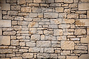 Stone facade restored wall assembled with pebbles of different sizes