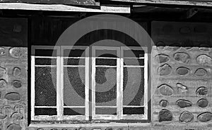 Stone Facade And Ripple Glass Windows Of Vintage Home