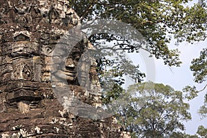 Stone face in Bayon temple in ancient city Angkor