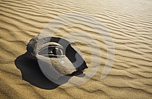 Stone face on desert