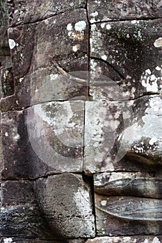 The stone face of the khmer king on the wall of Bayon Temple, Angkor Thom, Siem Reap, Cambodia