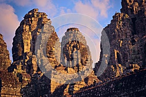 Stone face towers on the Bayon temple, located in Angkor, Cambodia, the capital city of the Khmer empire. View from the western co