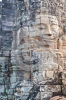 Stone faces in Angkor Thom temple, selective focus. Buddhism meditation concept, world famous travel destination, Cambodia tourism