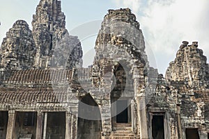 Stone faces on facade at Bayon Temple in Angkor Tom, Siem Reap, Cambodia