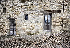 Stone faÃÂ§ade and cobble street photo