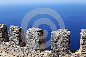 Stone fence on a background of the sea