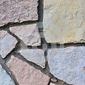 Stone fence background, stonewall macro closeup, decorative limestone dolomite calcium carbonate hard sedimentary slate slab rock