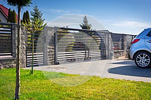 Stone fence and entrance gate with remote control