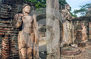 Stone figure of standing Buddha in broken 12th century buddhist temple, Sri Lanka. Ancient town Polonnaruwa.