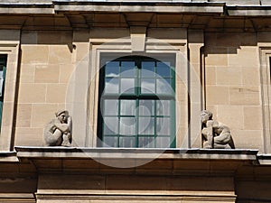 Stone figures on art-deco window