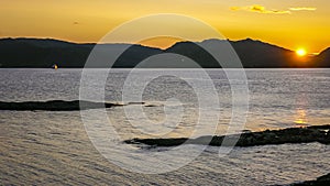 Stone fjord coast in Norway at sunset