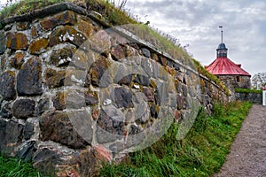 Stone fortress wall of Korela castle in the city of Priozersk in Russia