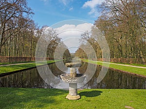 Stone fountain by the beautiful pond in Kasteel De Haar