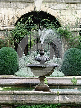 Stone fountain in classical garden