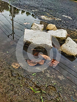 Stone fragments submerged in water photo