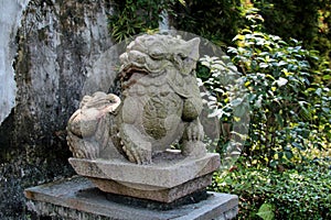 A stone fu dog sculpture, Keyuan Garden, Dongguan City, Guangdong Province, China