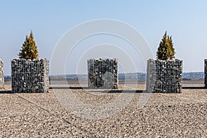 Stone gabions with trees urban landscape near the highway