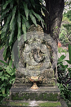 Stone Ganesha statue with the incense sticks